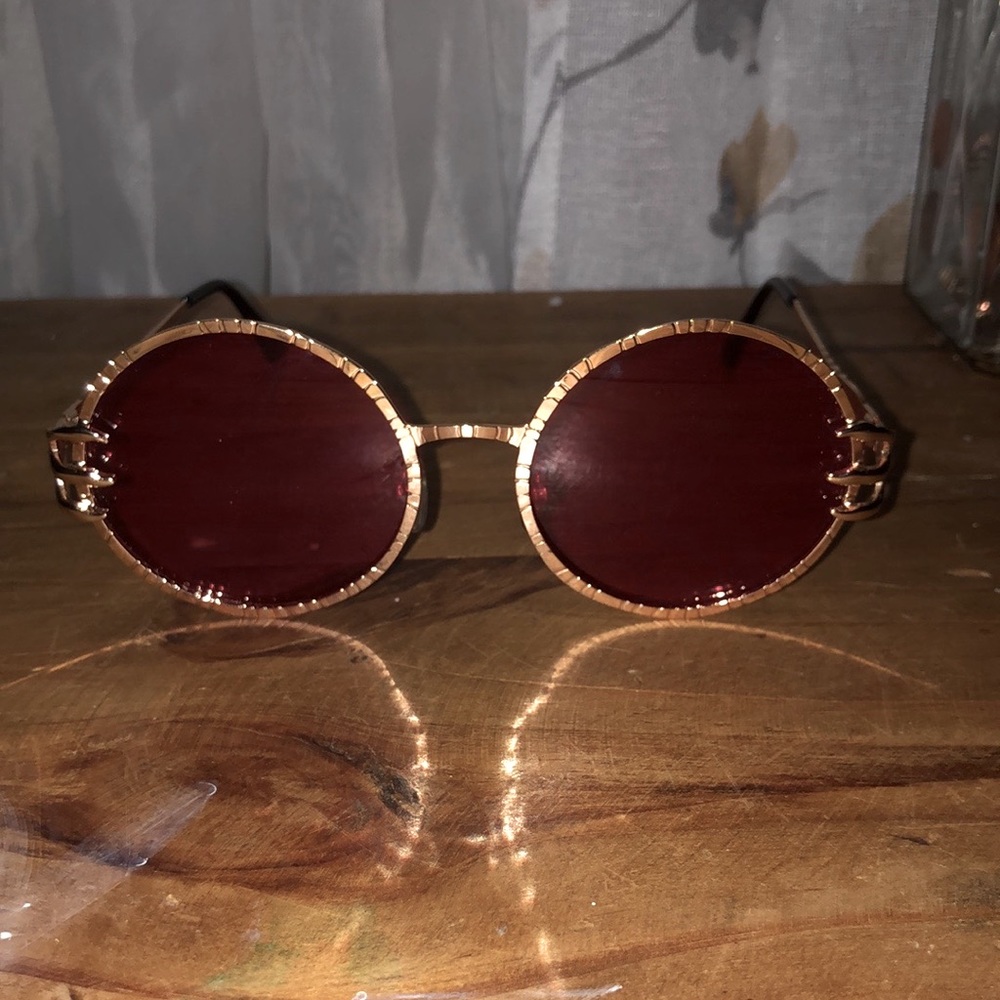 Red and gold circular sunglasses